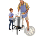 Large stainless steel seafood boiling kit stockpot with perforated lid on black metal stand for outdoor use
