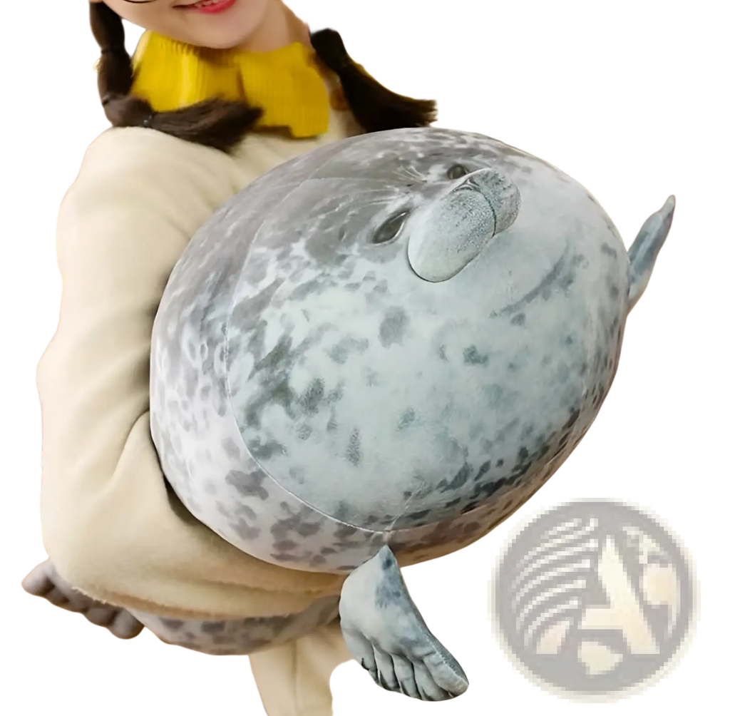 A large seal plush toy with soft gray and white speckled fabric, small flippers, and a gentle facial expression