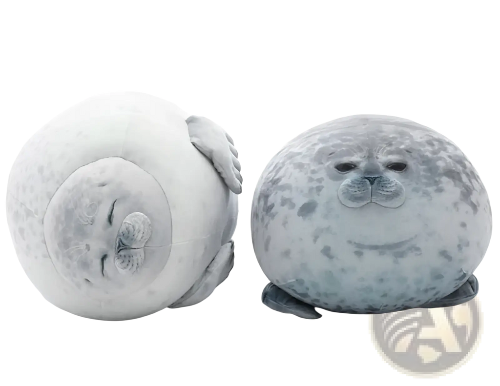 Two large spotted seal plush toys in white and gray speckled soft fabric shown sitting and lying down