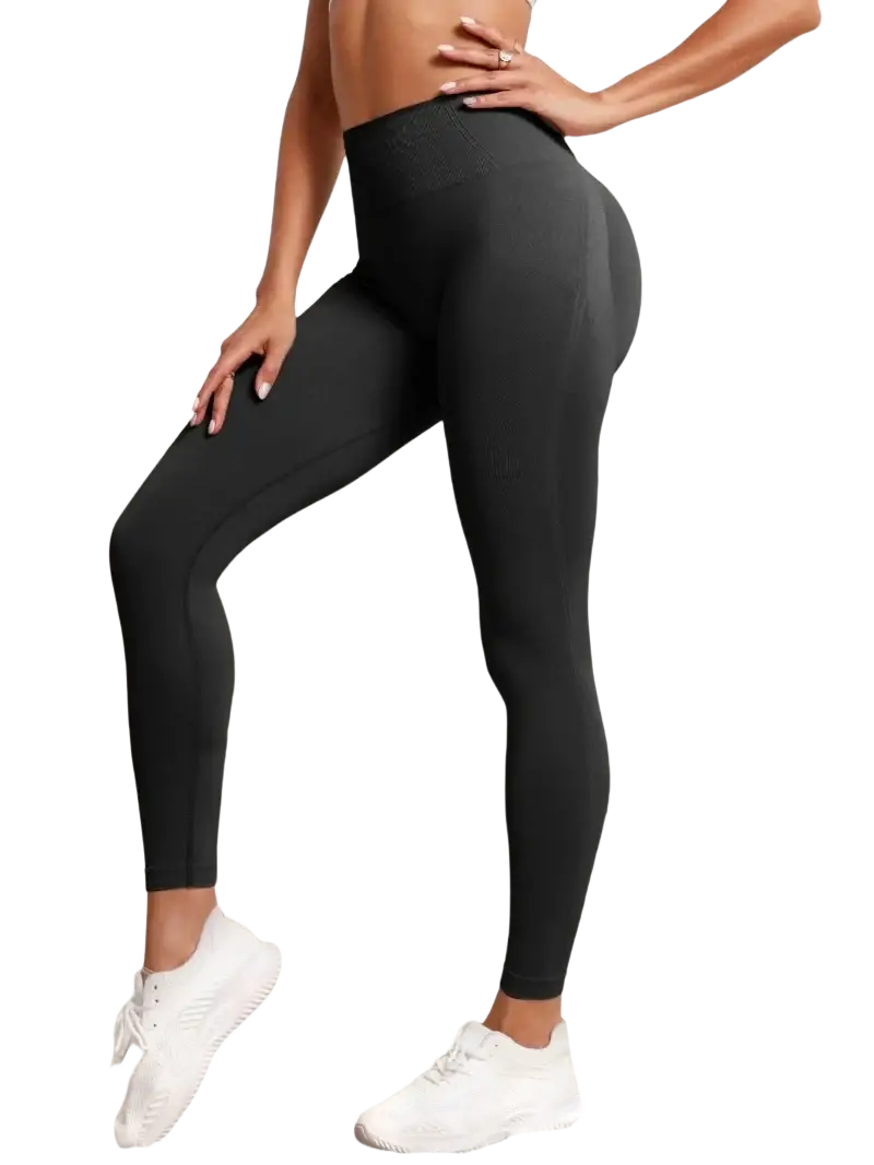 Black seamless high waist butt lifting leggings made of smooth form-fitting stretch fabric shown from the back side