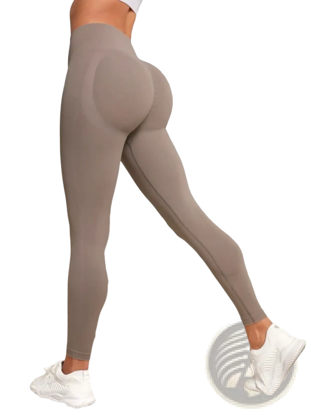 A pair of taupe seamless high waist butt lifting leggings with smooth stretchy fabric and subtle seam detailing