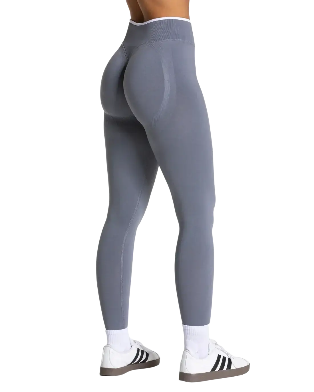 Seamless high waist gray workout leggings with a smooth form fitting design and white trim at the waistband