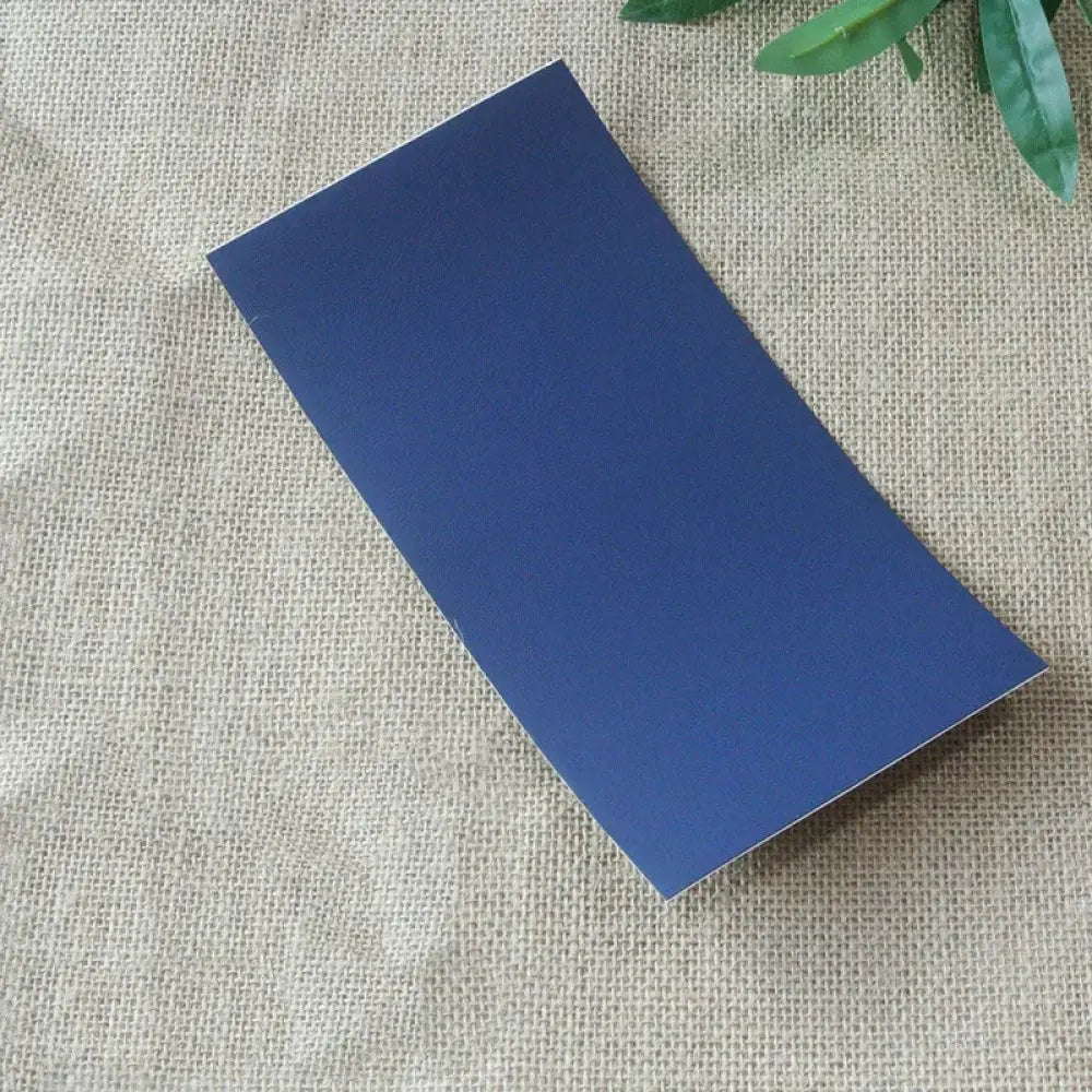 A sleek solid navy blue self-adhesive leather sofa repair patch with a smooth matte finish rectangular in shape