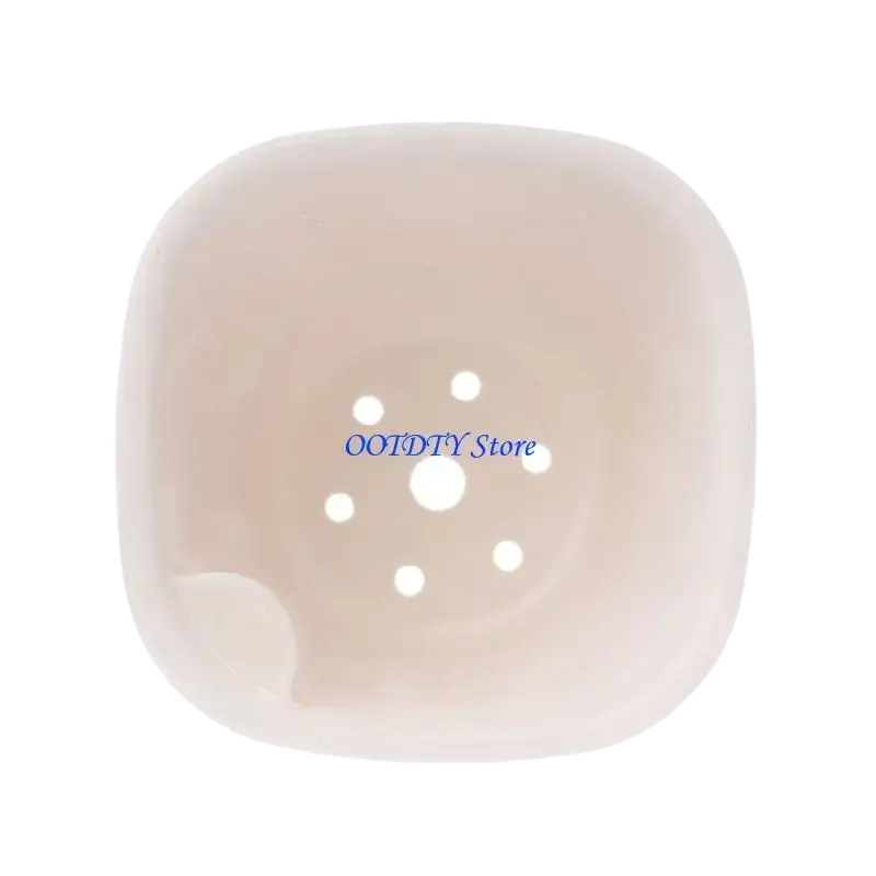 A translucent pale pink ceramic soap dish with rounded edges and six-hole pattern for flower pot drainage