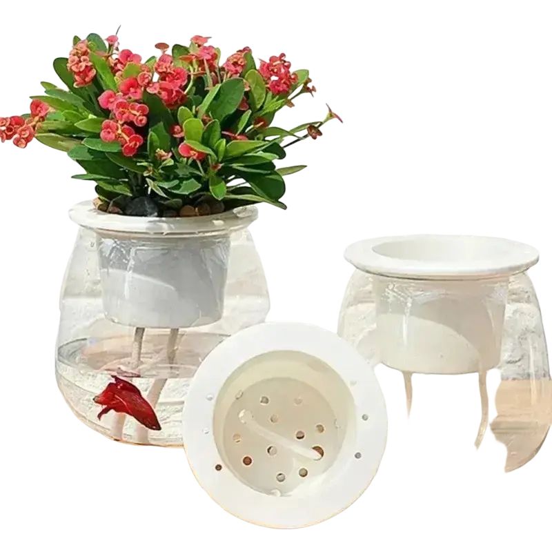 Clear glass self-watering mini planter with white ceramic insert and perforated lid holding red flowering plant