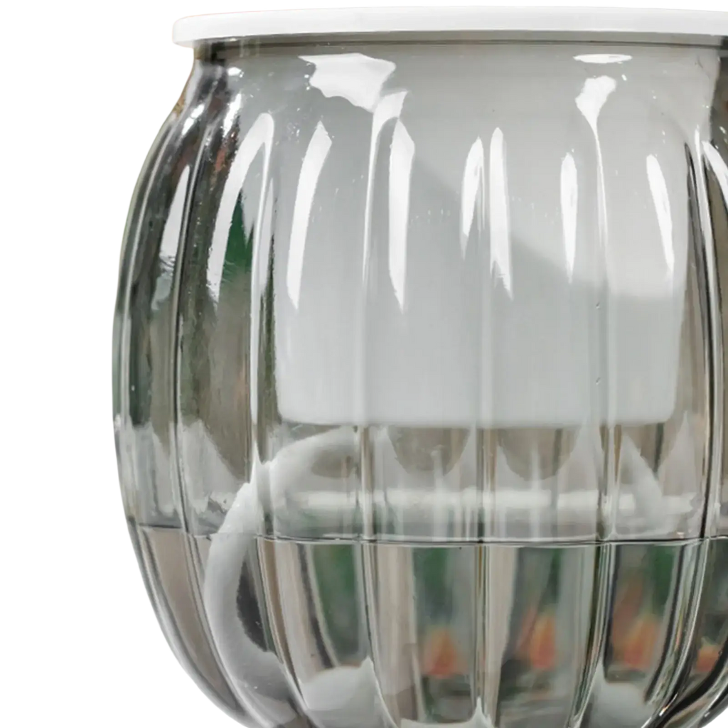 A sleek translucent gray glass self-watering planters pot with vertical ridges and a white lid in pumpkin style