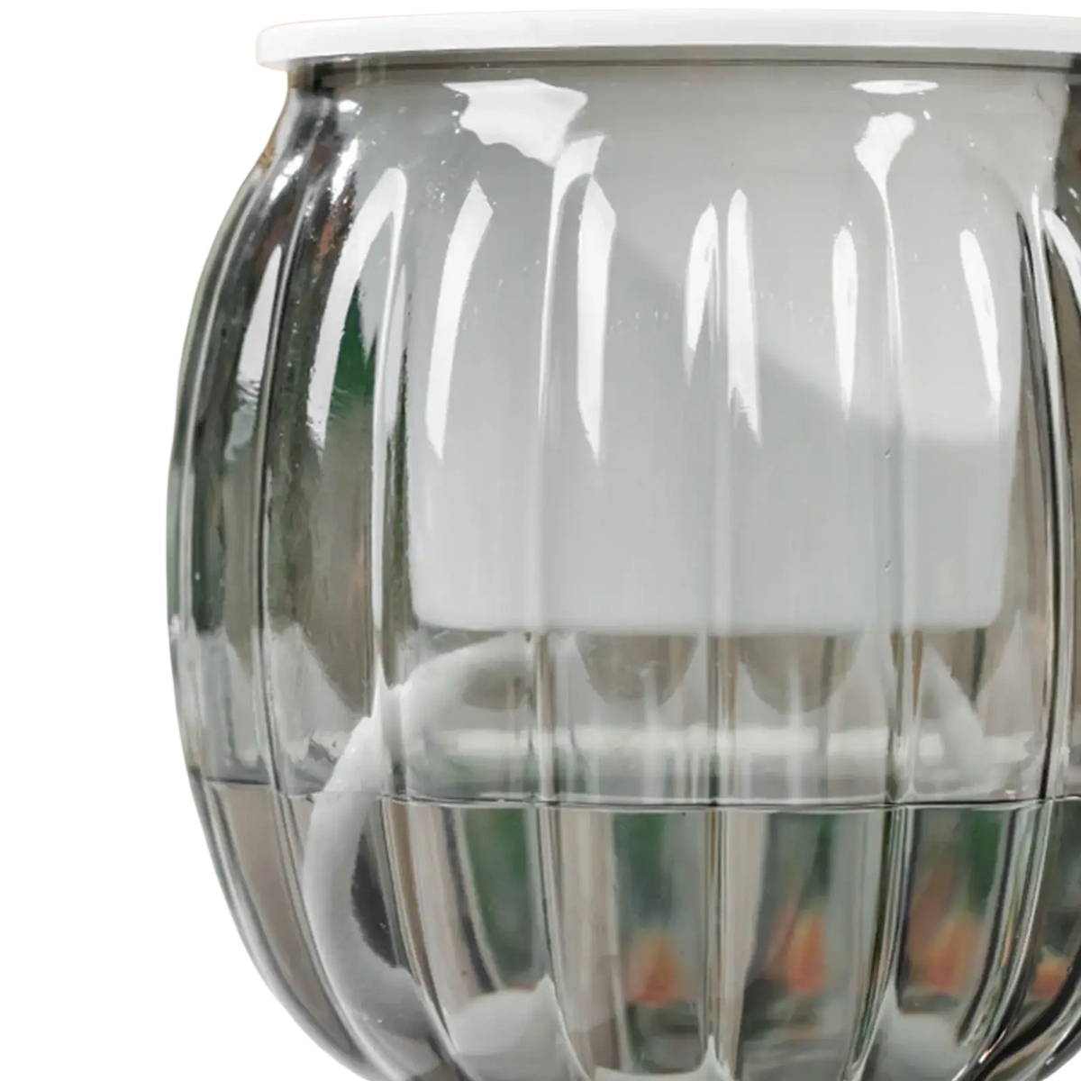 A sleek translucent gray glass self-watering planters pot with vertical ridges and a white lid in pumpkin style