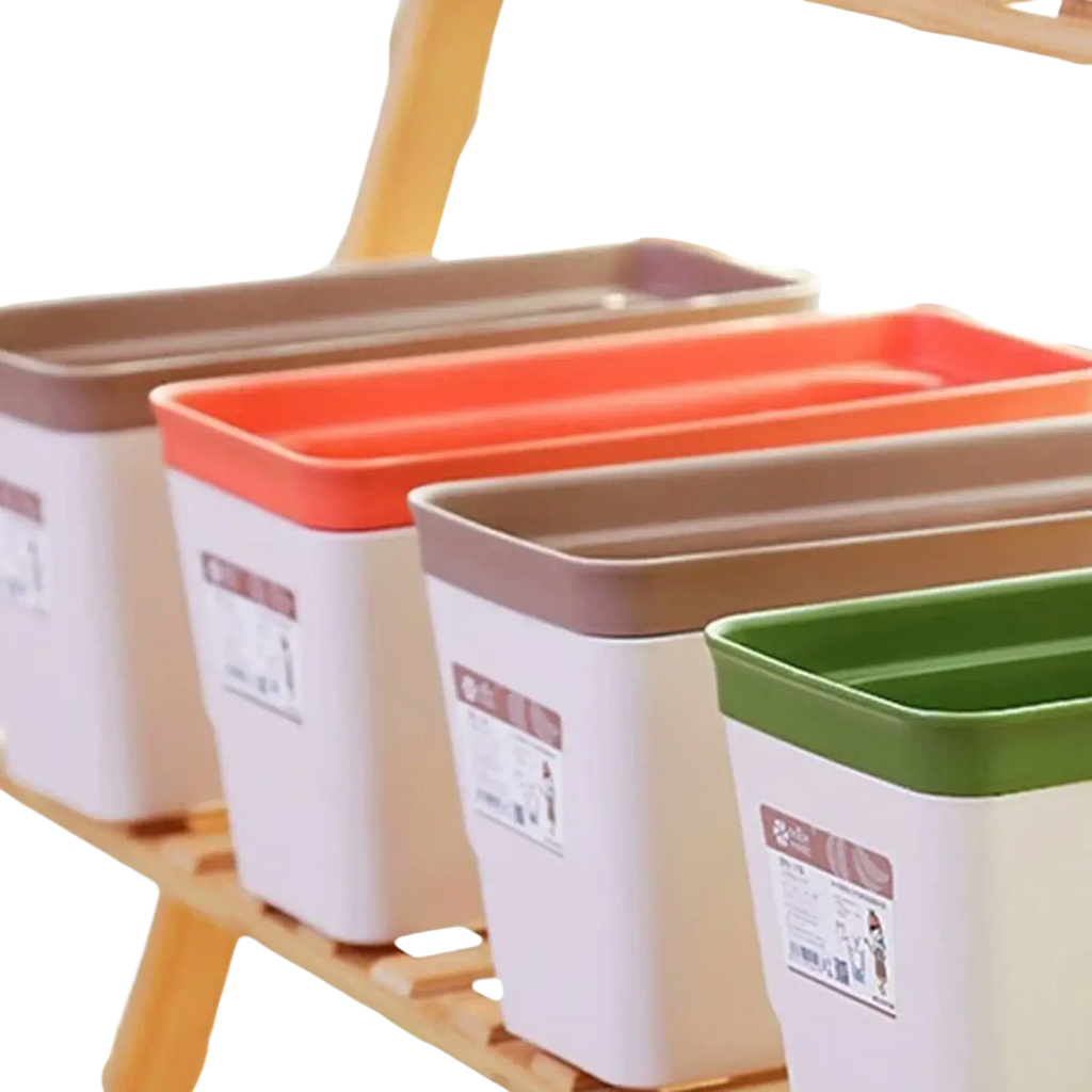 Set of four self watering plastic rectangular flower pots with white bodies colored lids and automatic watering cotton strips
