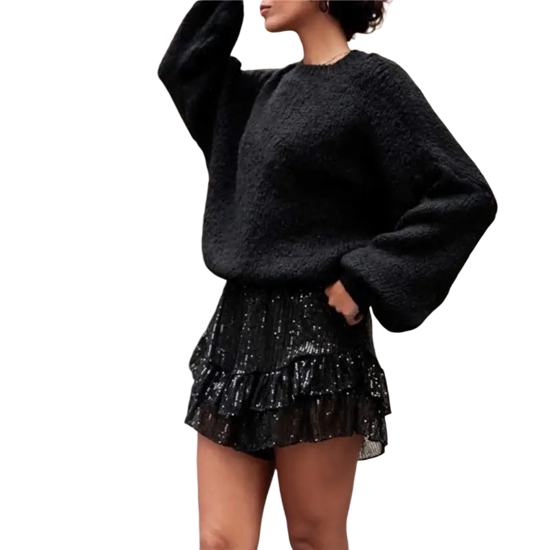 Black textured knit sweater with voluminous sleeves paired with sequin elastic waist ruffle shorts