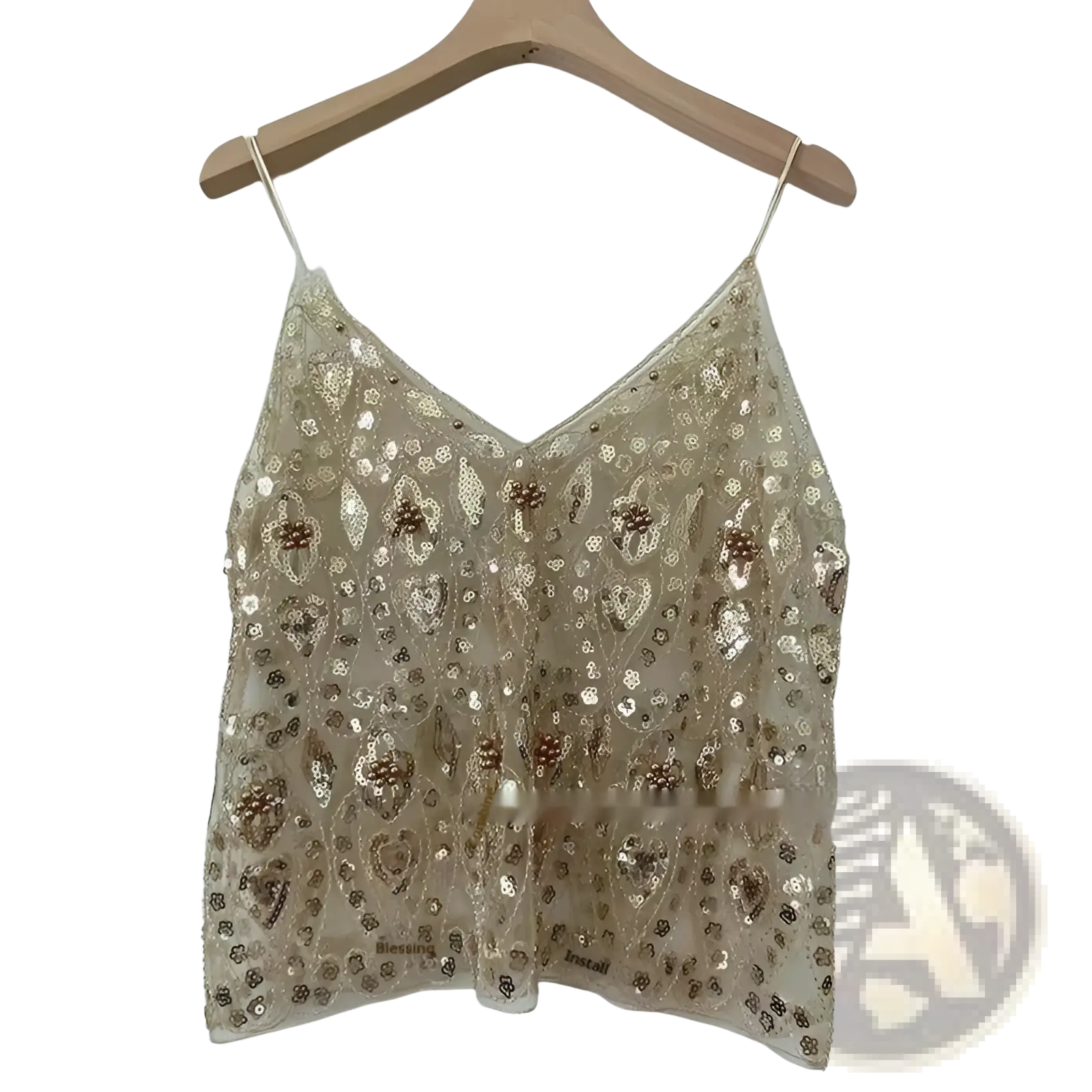 A delicate gold sequin embroidered mesh camisole top with v-neckline and thin spaghetti straps featuring floral patterns