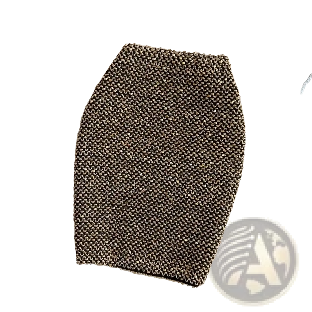 A textured metallic gold knit sequin mini skirt with a high waist and tight fit for glitter party wear