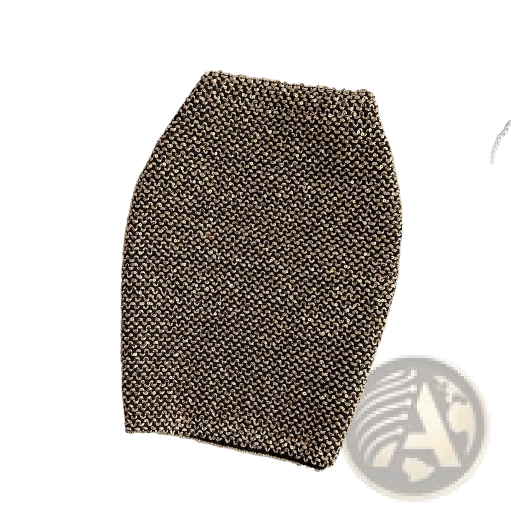 A shimmering gold and black knitted sequin mini skirt with a textured woven pattern for high waist party wear