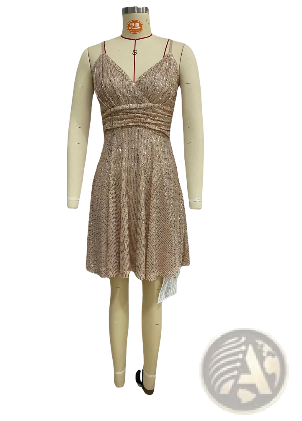 A shimmering gold sequined cross strap vacation dress with v neckline and ruched waist displayed on a mannequin