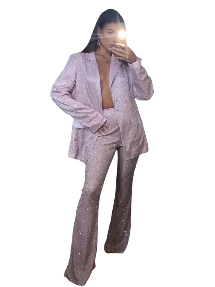 A shimmering lavender sequined oversized blazer with matching flared trousers creating a glamorous two-piece suit