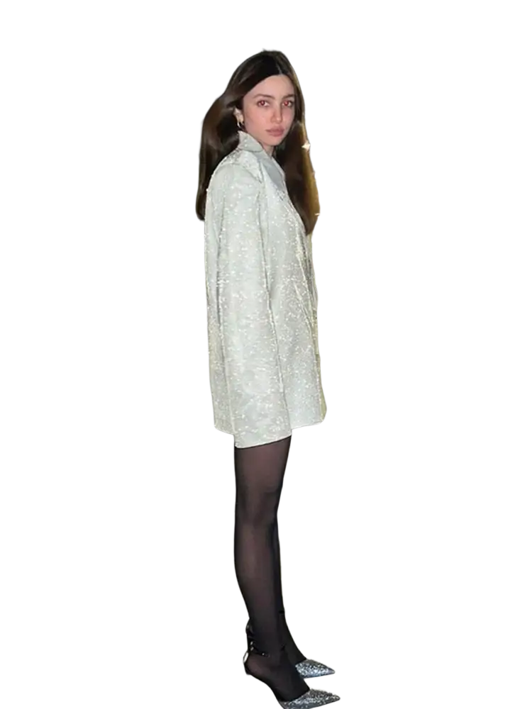 Sequined oversized blazer for women in shimmering silver with structured collar worn over black tights and sparkling heels