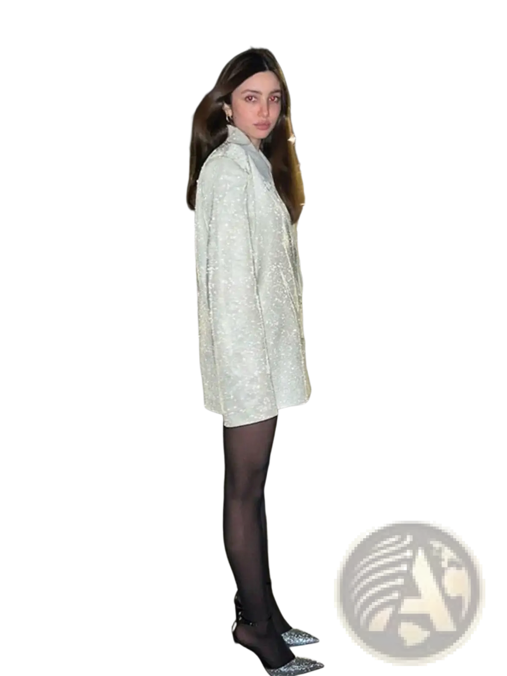 Sequined oversized blazer for women in shimmering silver with structured collar worn over black tights and sparkling heels