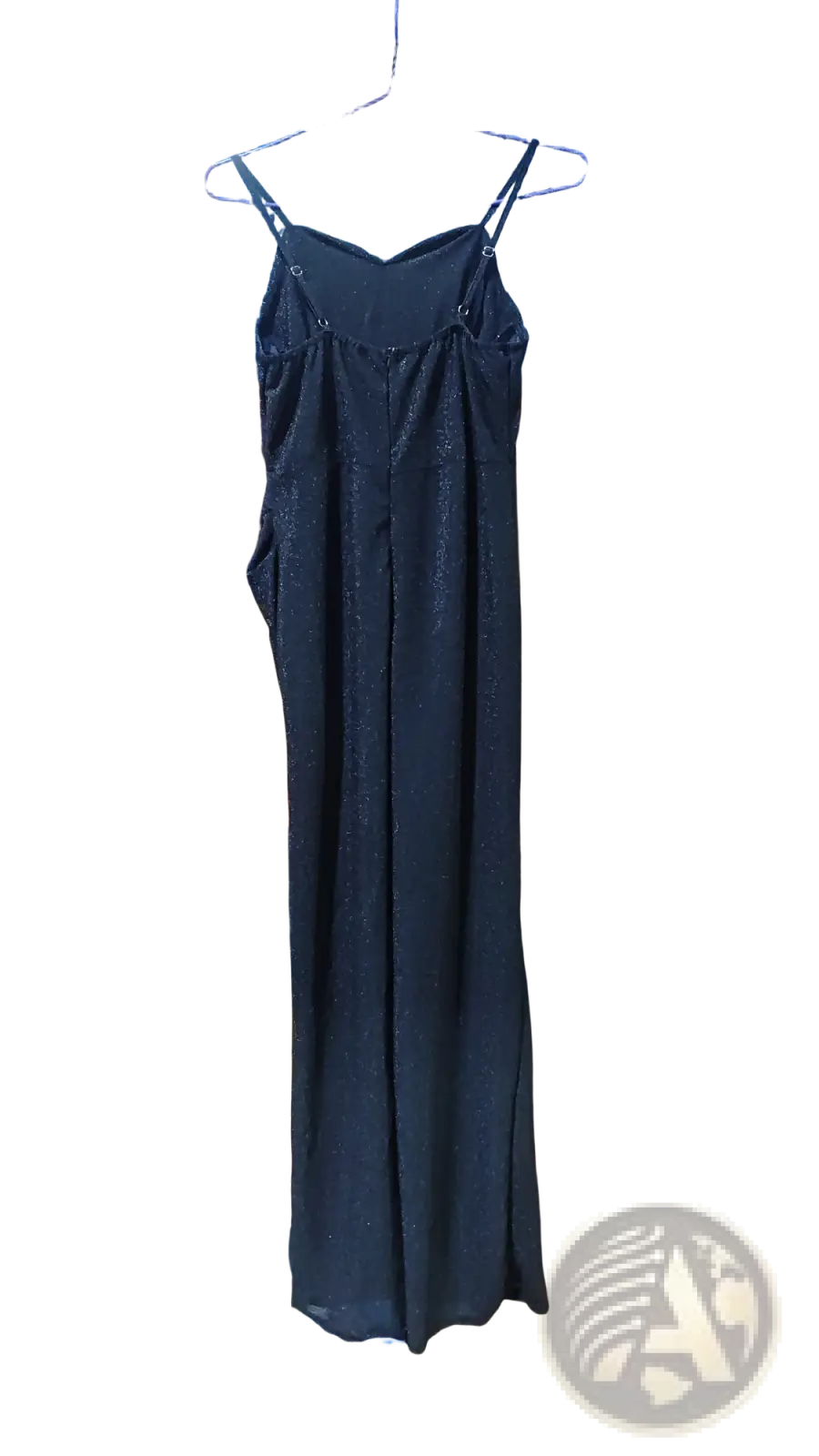 Black sequined spaghetti strap evening gown with v neck and high slit hanging on a hanger