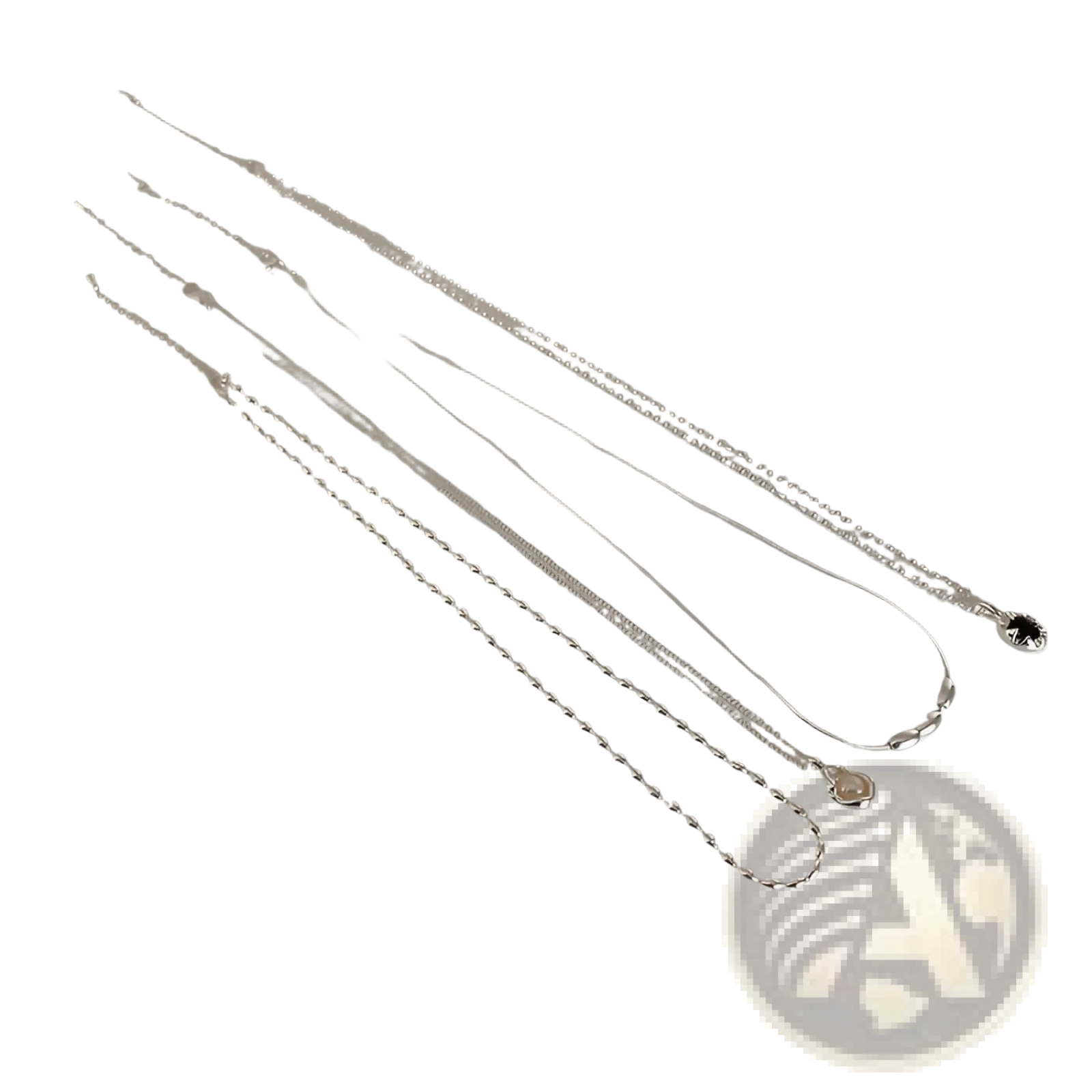 Set of five minimalist silver and pearl pendant necklaces with varying link styles displayed alongside a ruler for scale