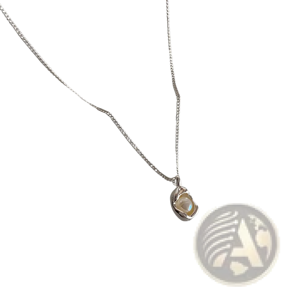 Set of five minimalist silver chain necklaces featuring delicate irregular silver pendants with single lustrous pearls