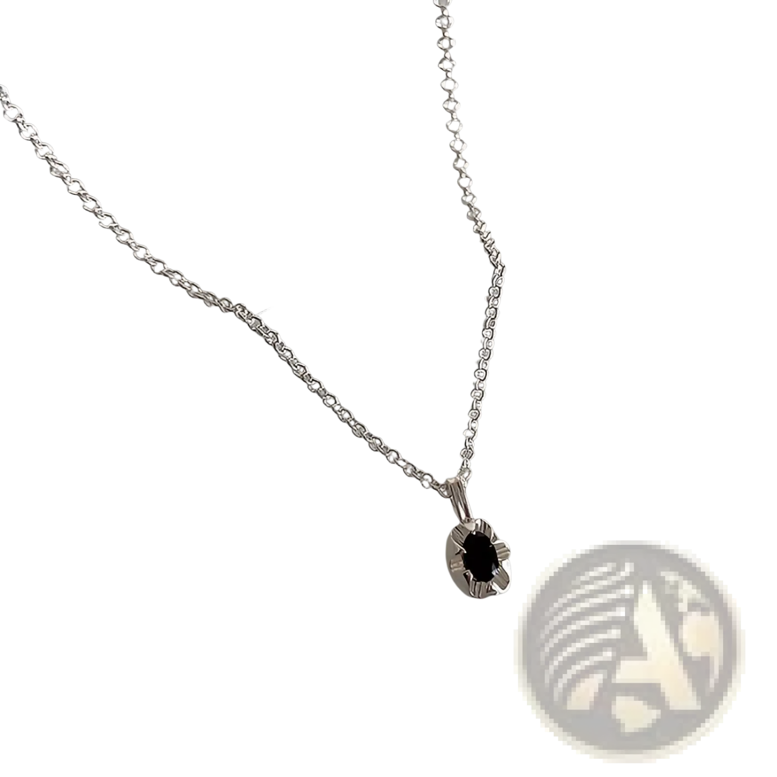 Silver chain necklace with delicate petal pendant and oval black gemstone set center from minimalist silver and pearl set
