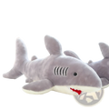A plush gray shark toy with red stitched teeth, black stitched gills, and a white underbelly for children