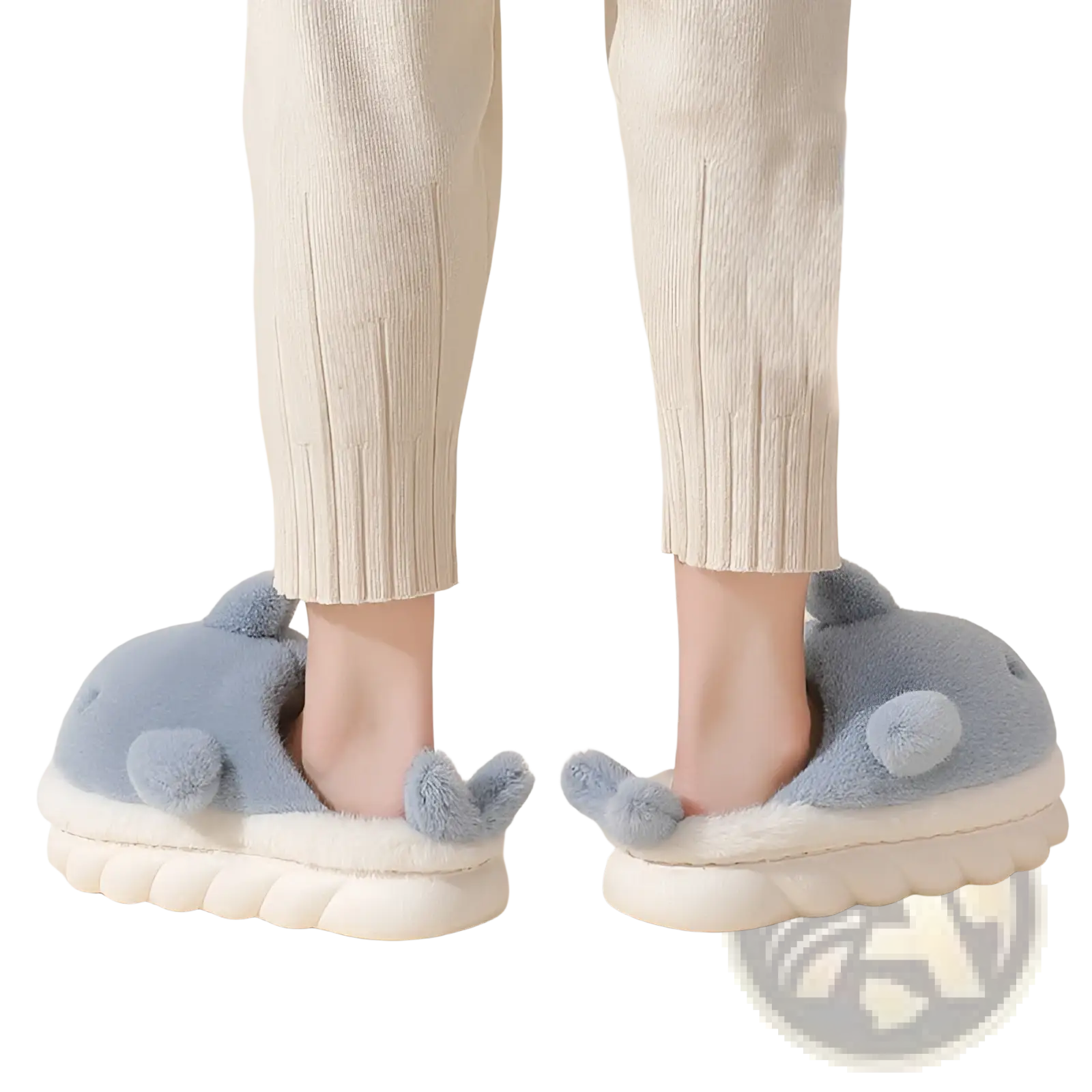 Light blue plush dolphin-shaped shark slippers with white fluffy soles and textured wave-patterned edges for indoors