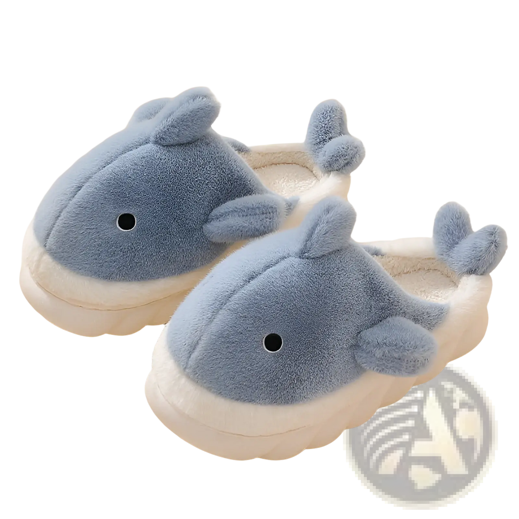 Soft blue plush whale-shaped shark slippers with white cushioned soles and embroidered black eyes for indoor use