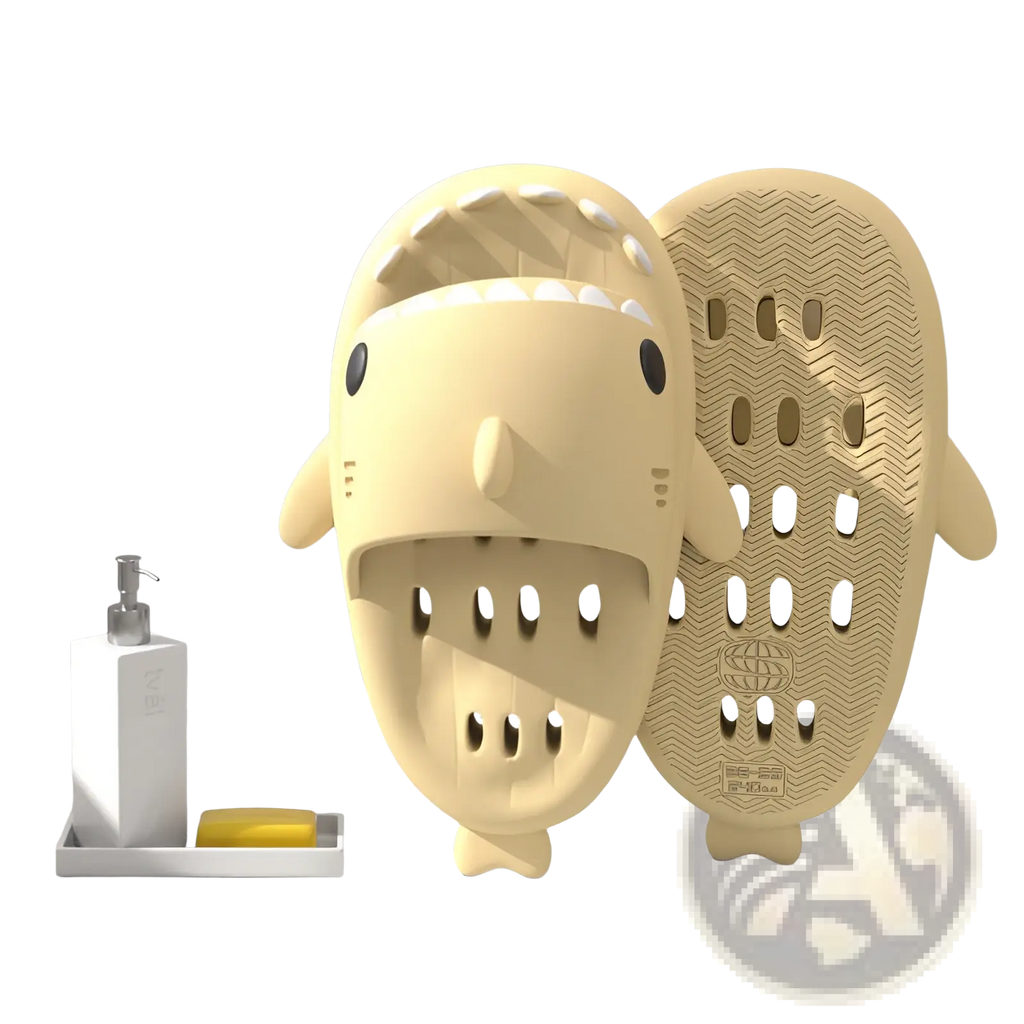 Cream-colored plastic shark slippers with black eyes white teeth and textured non slip sole for quick dry shower use