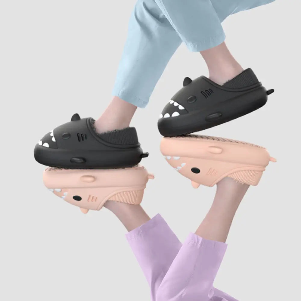 Plush shark winter house slippers slip-on in black and peach with soft rubber soles and embroidered eye details