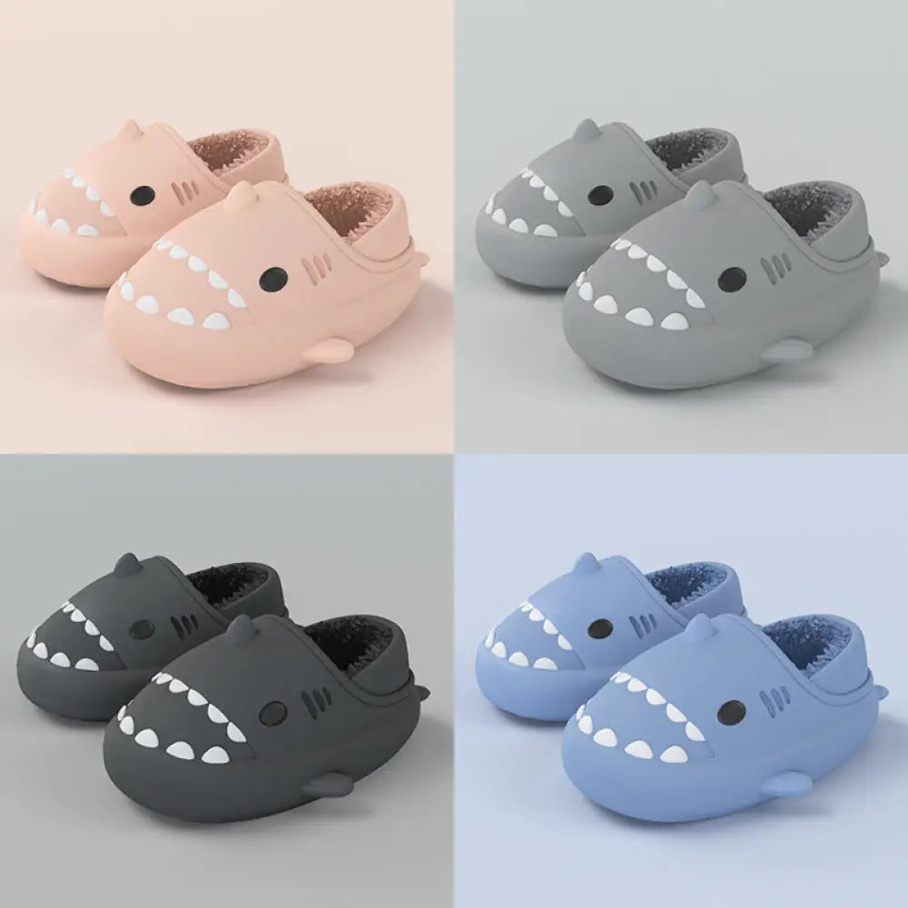 Plush shark winter house slippers in pastel pink gray dark gray and light blue with soft rubber soles and white teeth details