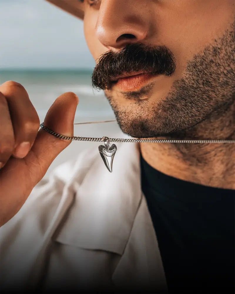 Silver stainless steel shark tooth pendant necklace with a fine chain for stylish everyday wear