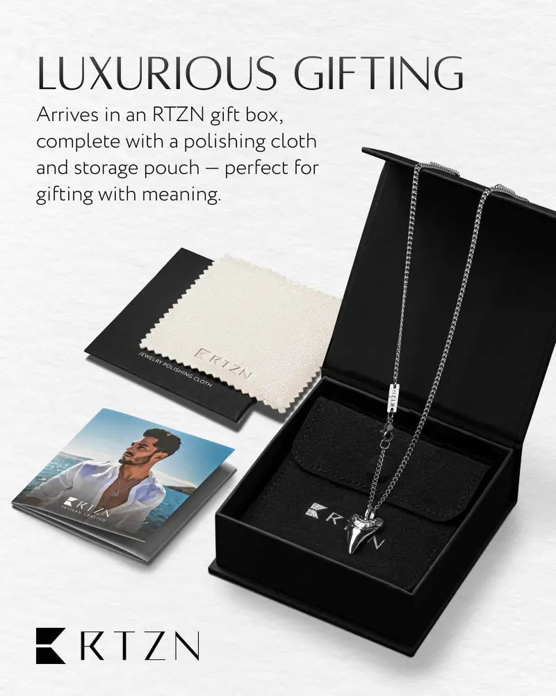 Rtzn silver stainless steel shark tooth pendant necklace in sleek chain displayed in an rtzn gift box