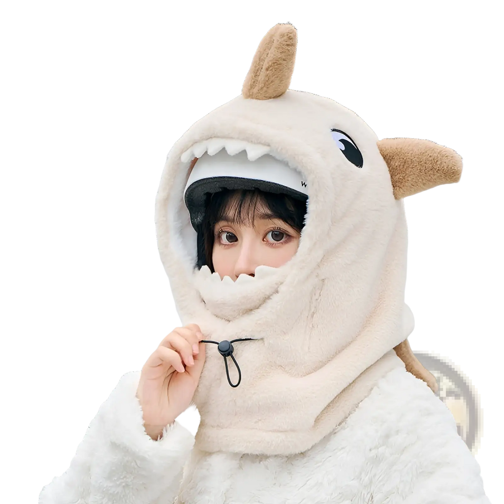 Cream-colored plush shark winter hat with brown ears white teeth and black adjustable chin strap for ear protection