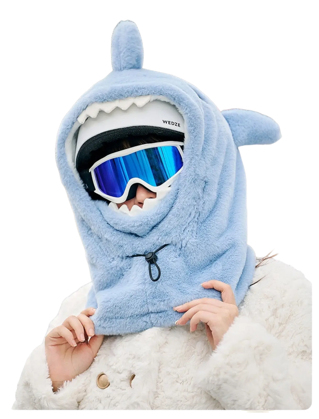 Light blue plush shark-shaped winter hat with white teeth and black drawstring closure for ear protection