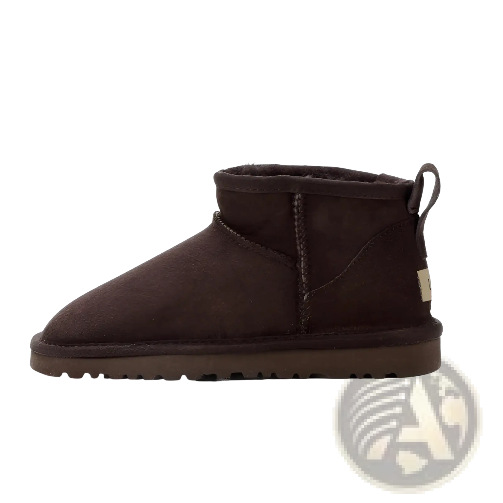Dark brown suede sheepskin mini snow boot showing back side with plush interior and pull tab for easy wear