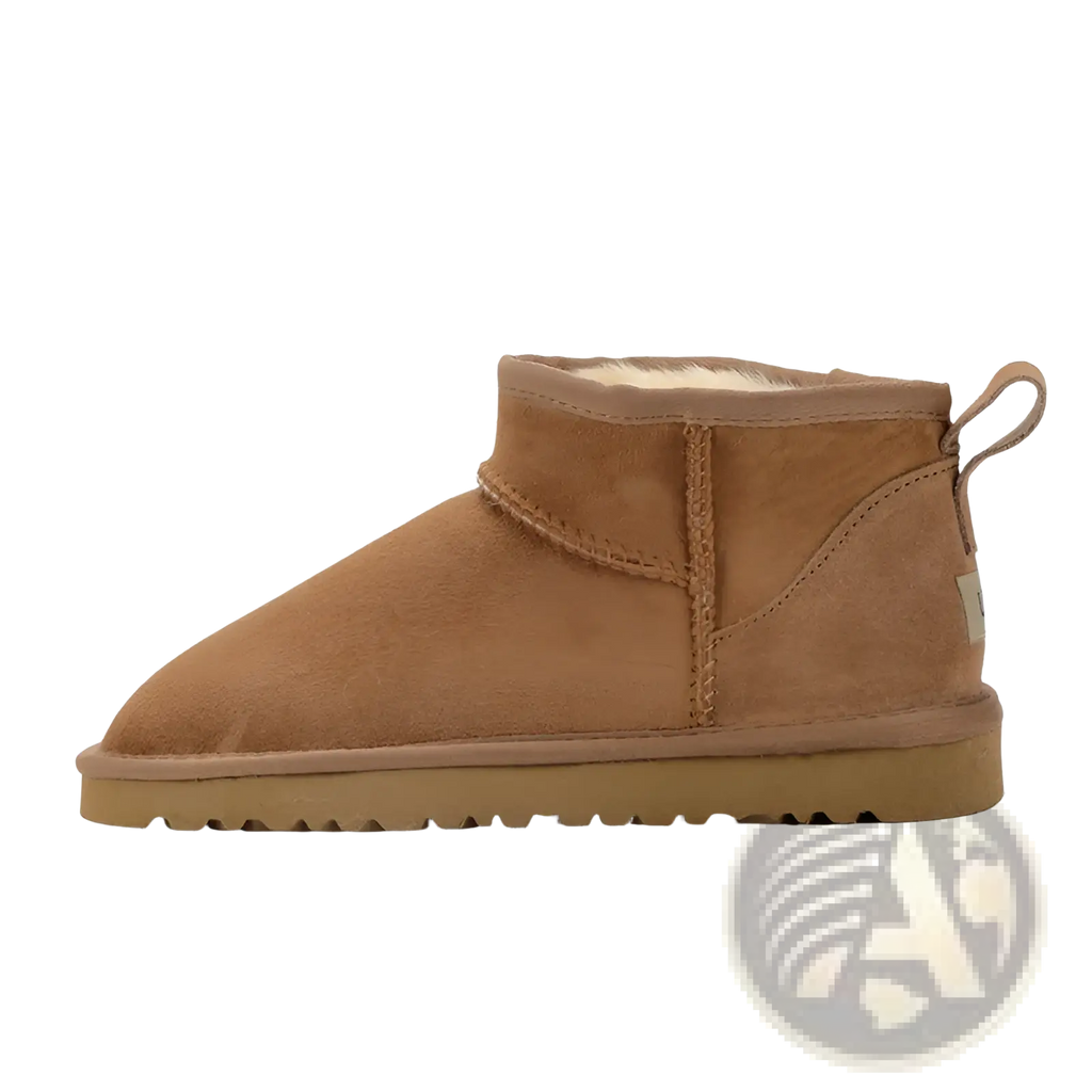 Sheepskin mini snow boots in tan suede leather with plush white shearling lining and durable rubber sole