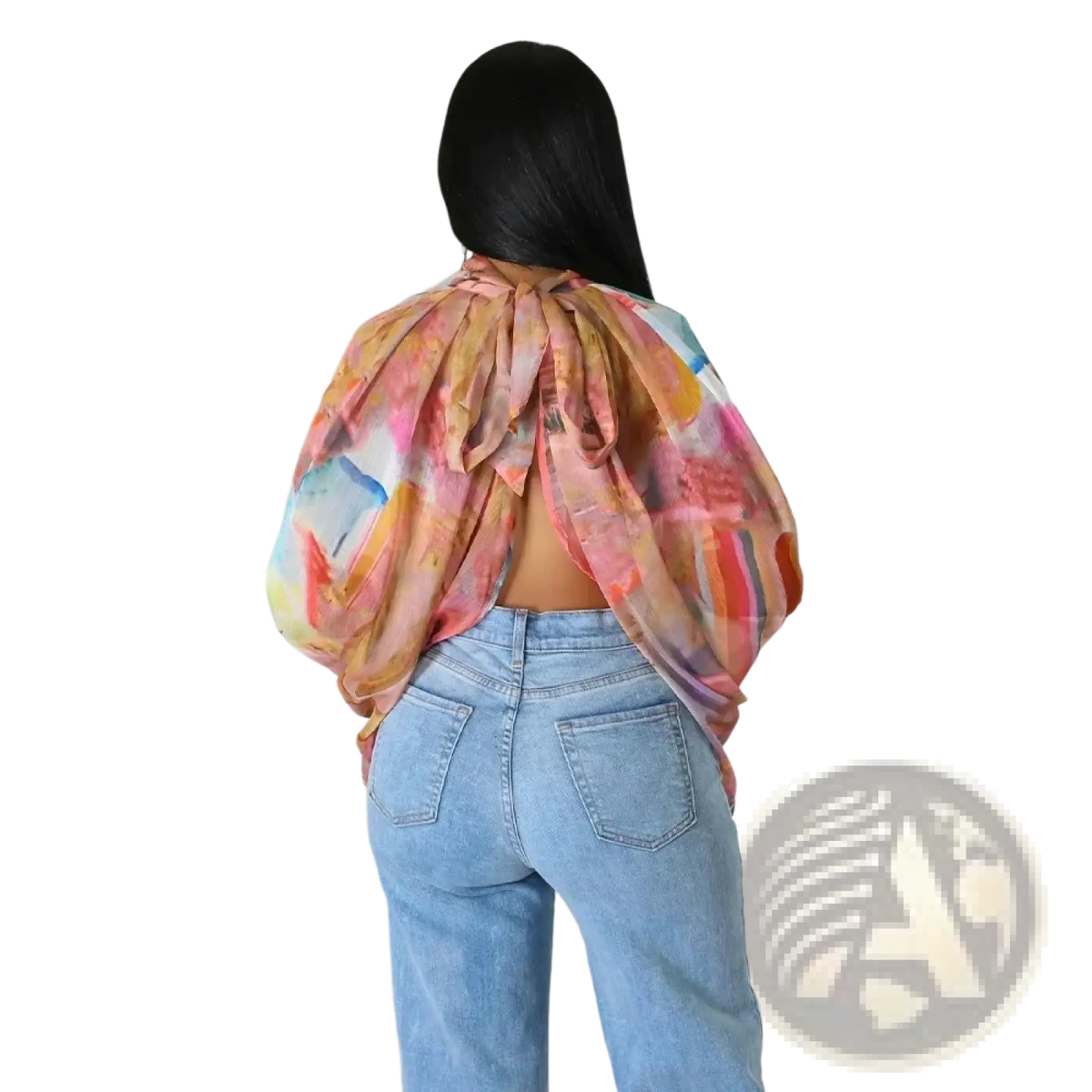 Back view of a vibrant sheer chiffon blouse with colorful abstract print and puffed sleeves tied into a bow