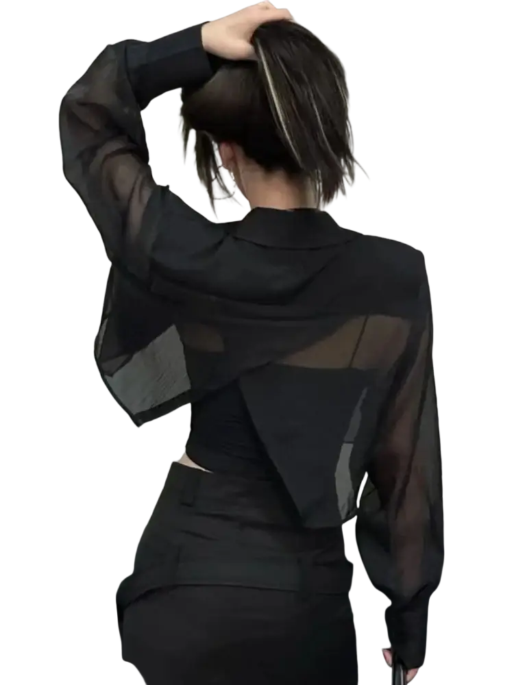 Back view of black sheer cropped blazer with mesh fabric layered design and cutout detail for office wear