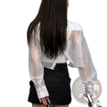 White sheer long-sleeved blouse with cropped fit and solid white cuffs paired with black mesh office jacket