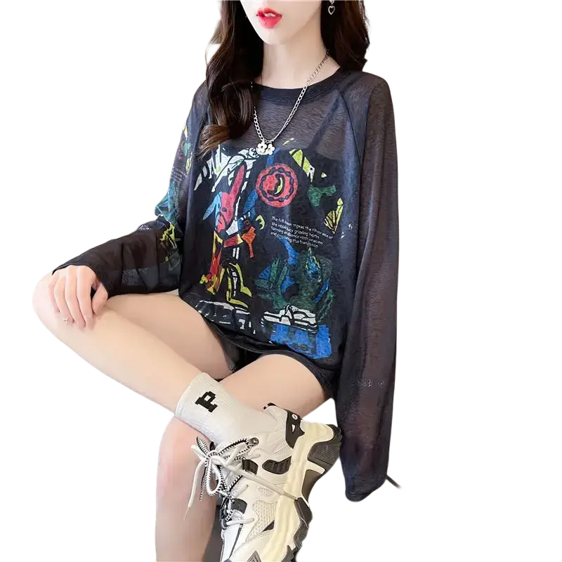 Black sheer long sleeve top with colorful graffiti style graphic print showcasing a trendy modern design