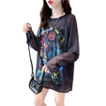 Black sheer long sleeve graphic print top with colorful layered design perfect for stylish casual wear