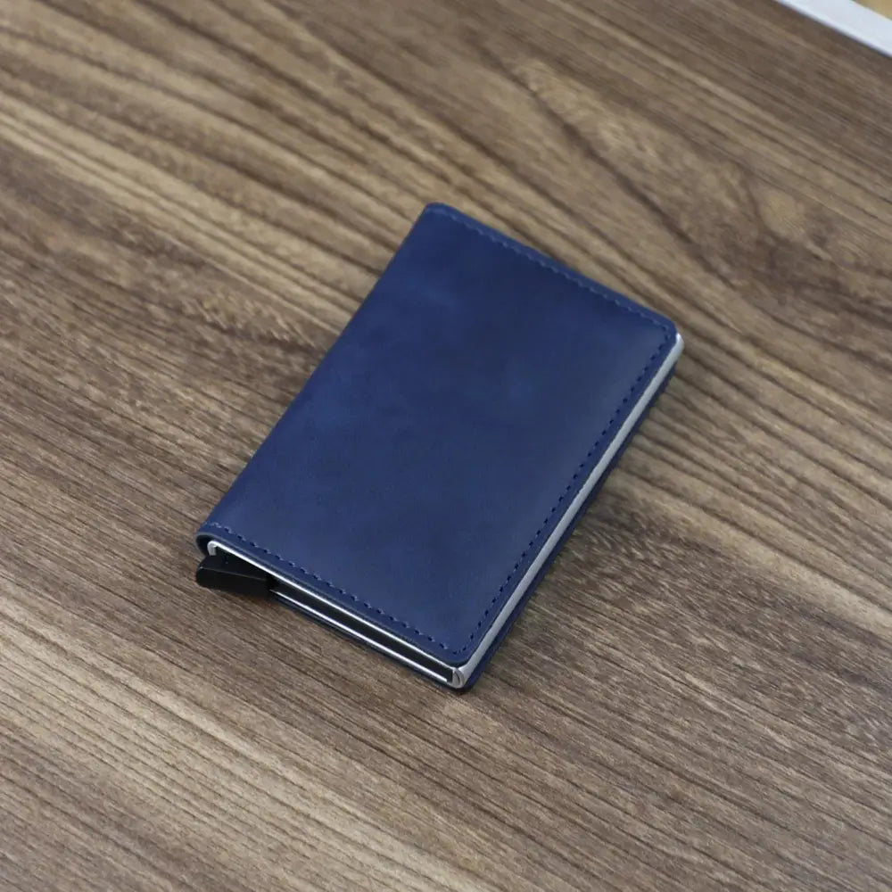 Navy blue leather slim RFID blocking aluminum alloy card case wallet with silver metal edges and magnetic closure