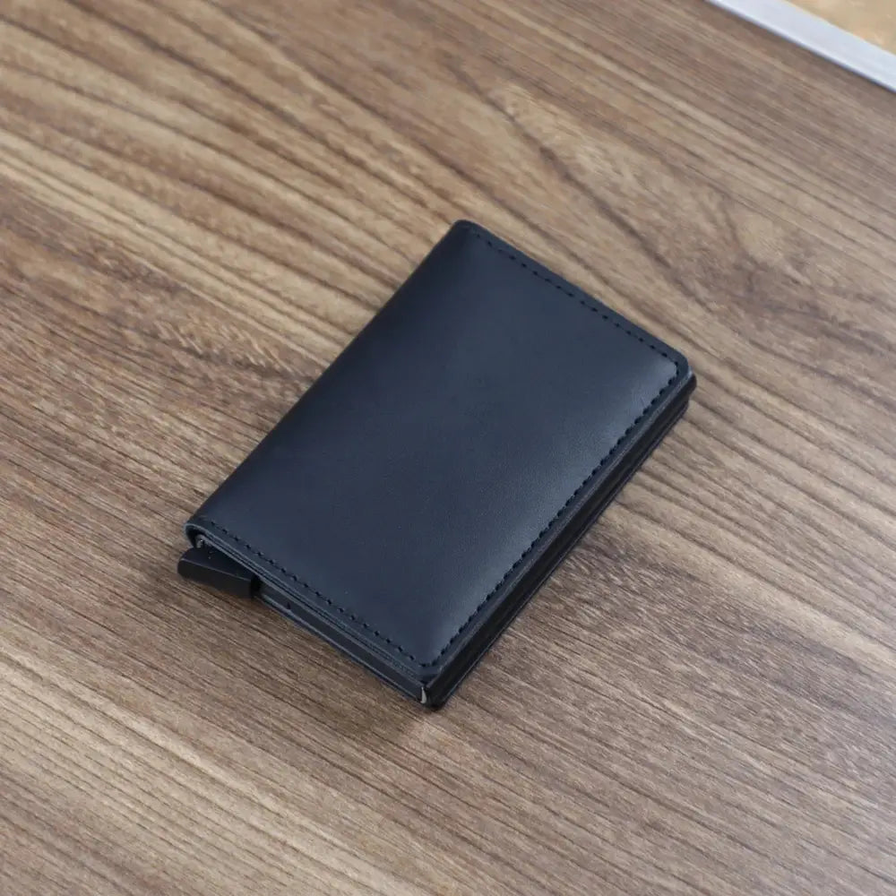 Black leather slim rfid blocking aluminum alloy card case wallet with precise stitching and minimalist design
