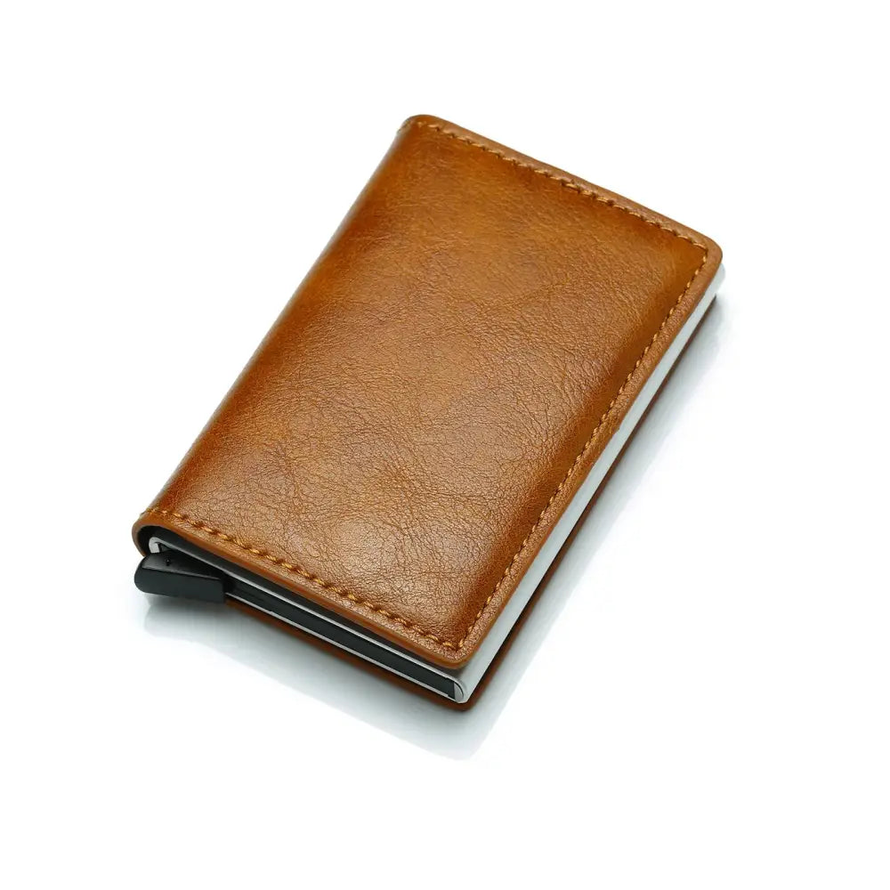 Slim RFID blocking aluminum alloy card case wallet in brown leather with sleek metallic interior and black magnetic closure