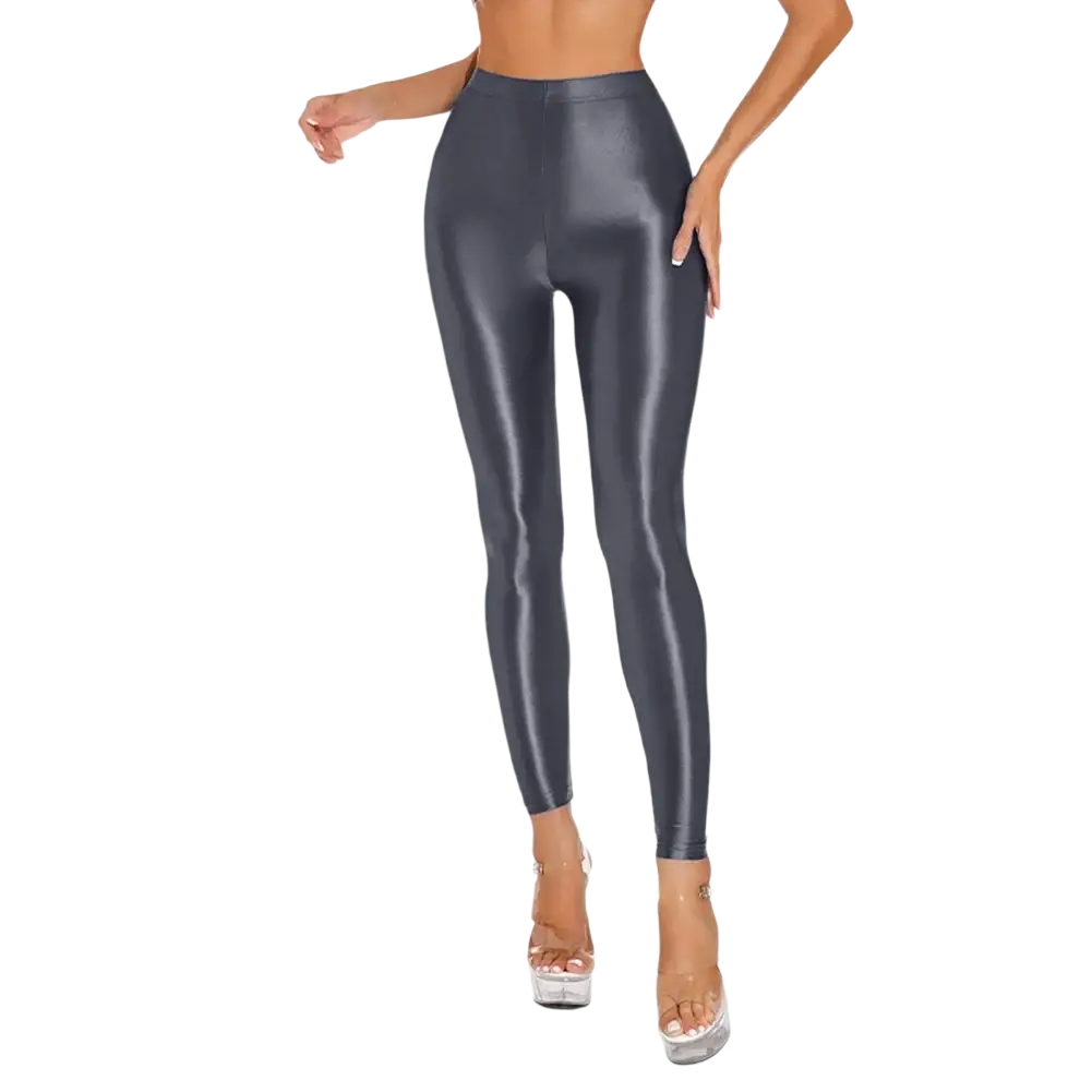 High-waisted shiny metallic disco leggings in black glossy faux leather with a sleek, form-fitting design