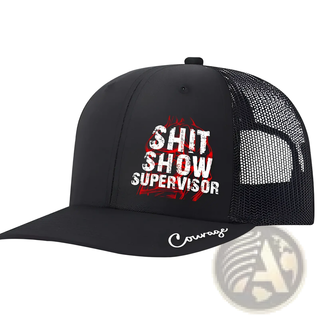 Black trucker hat with mesh back and front panel featuring bold white shit show supervisor text and embroidered courage brim
