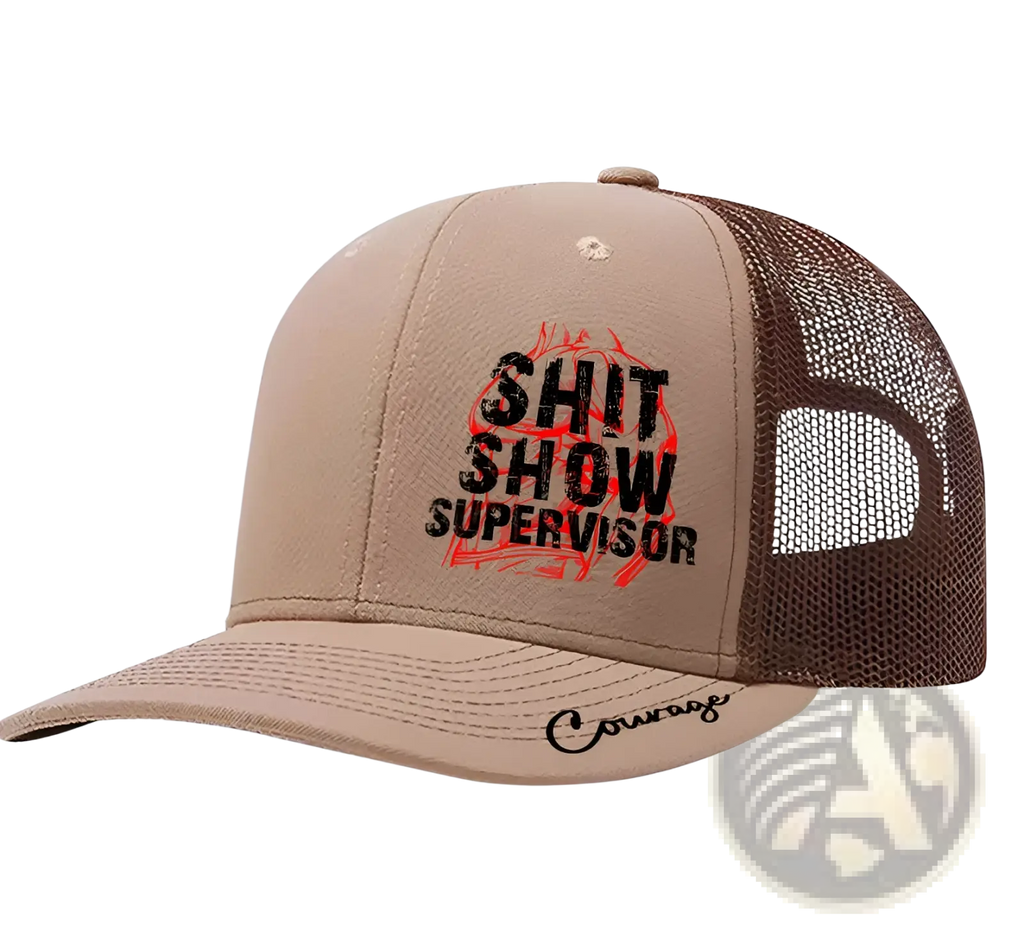 Tan and brown trucker hat with shit show supervisor text over red flame and courage scripted on the brim for men