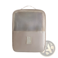 Beige portable travel shoe storage bag with mesh upper and solid lower section featuring travel label