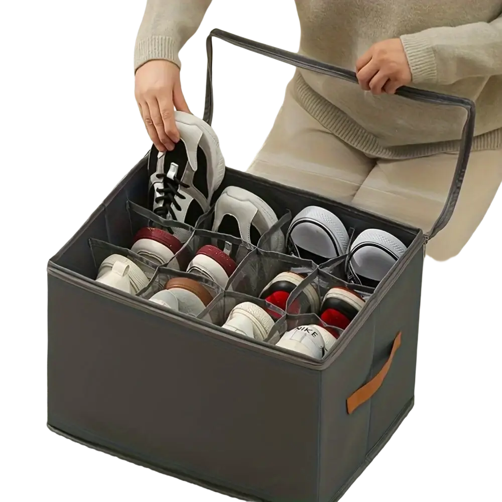 Dark gray foldable oxford fabric shoe storage organizer with transparent dividers and tan leather handle