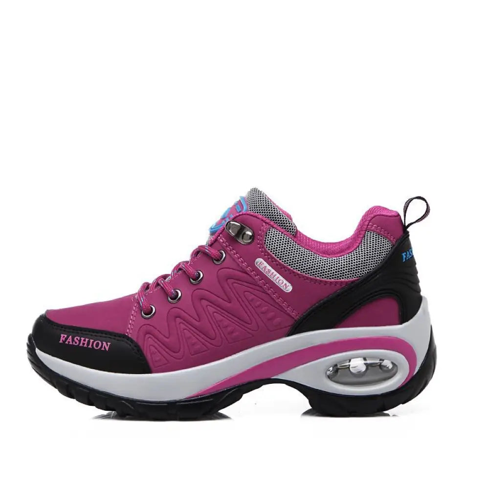 Women’s purple and black air cushion athletic hiking shoe with white midsole and visible heel air cushioning unit